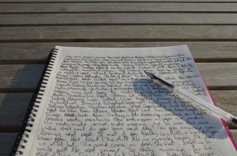 page of writing, complete with pen