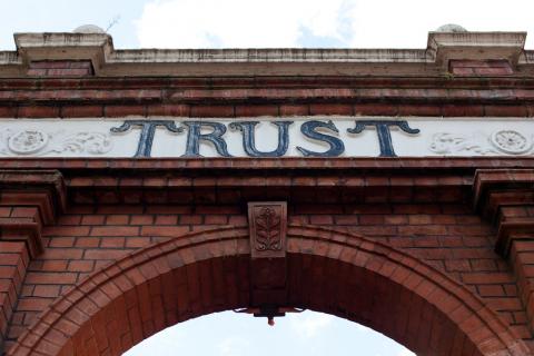 Image of arch with trust written on it