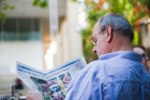picture of man reading newspaper