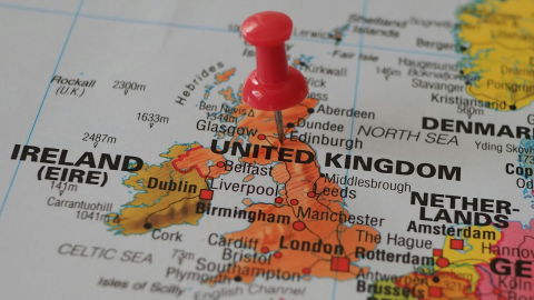 A photo of a map of the the United Kingdom of Great Britain and Northern Ireland with a pin in Edinburgh
