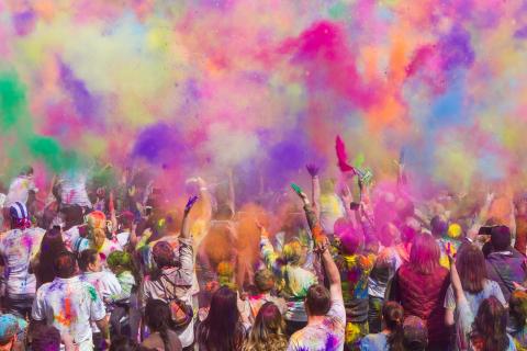 Coloured powders fill the air at the Holi festival