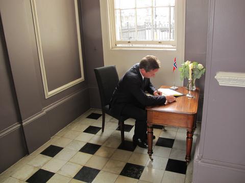 David Cameron at a desk