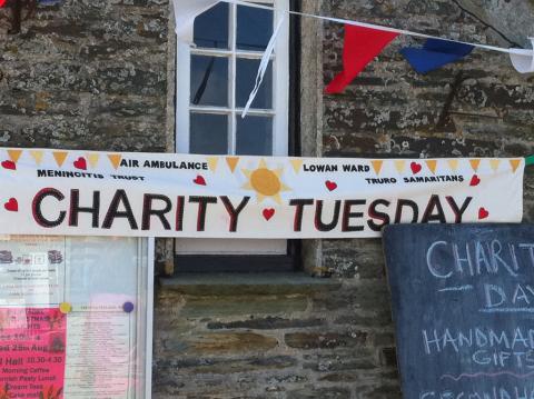 Banner for Charity Tuesday at local charity event