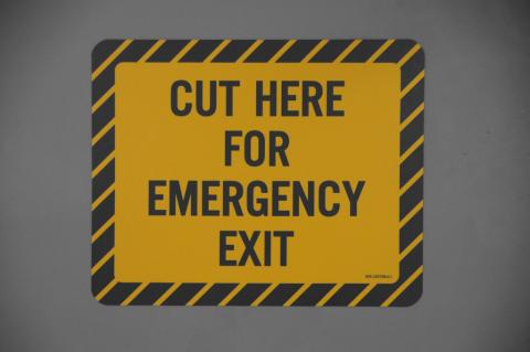 Warning sign which reads 'Cut here for emergency exit'