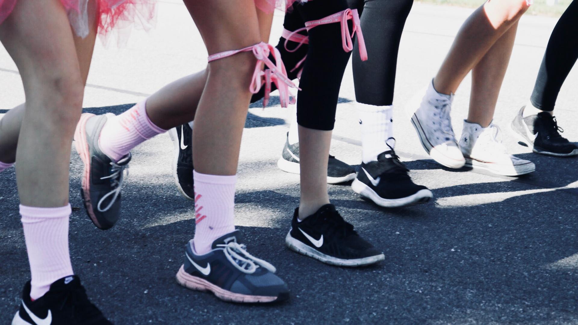 The legs of people taking part in a fun run