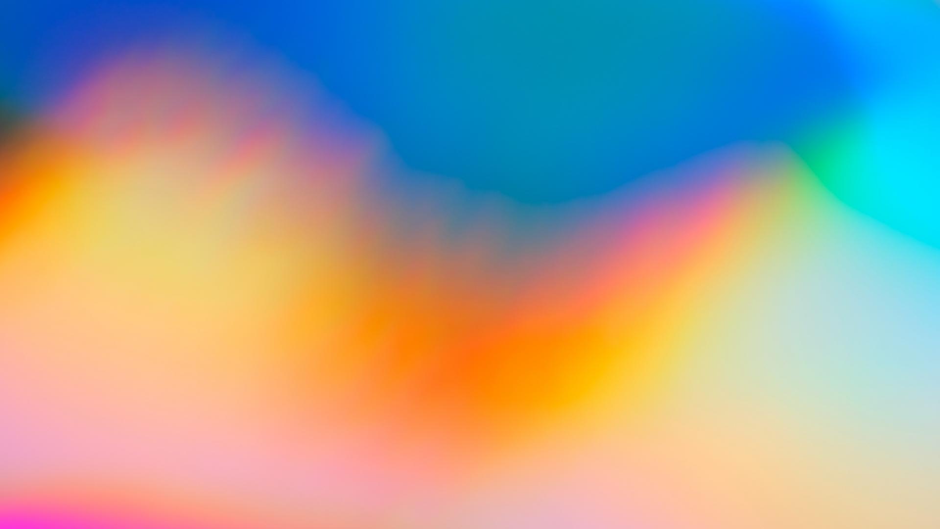 An abstract colourful image of blue, orange, pink and white