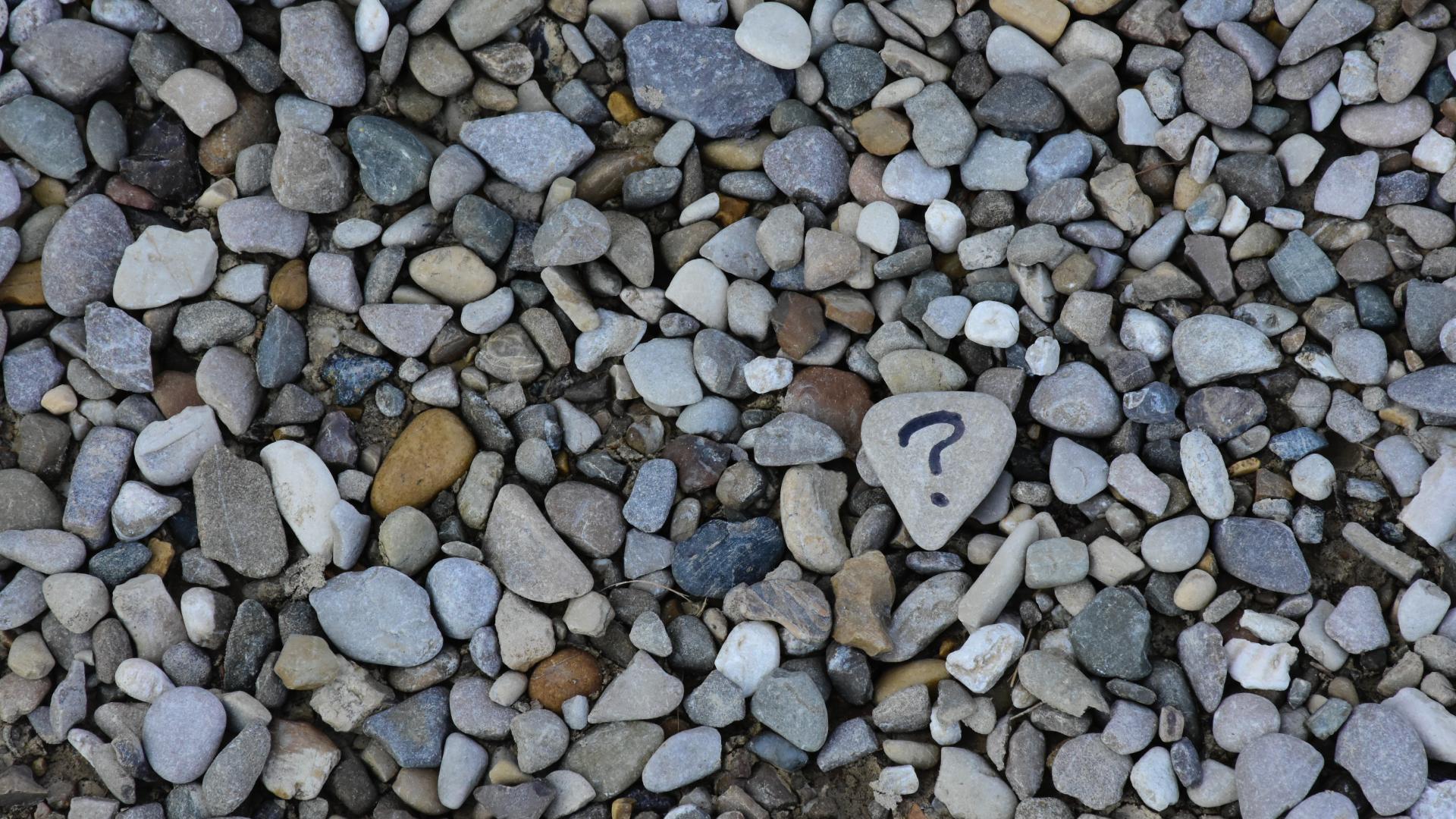 Pebble beach, one rock has a question mark on it