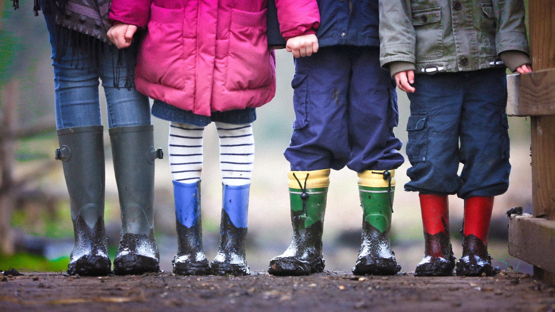Four children in muddy wellies