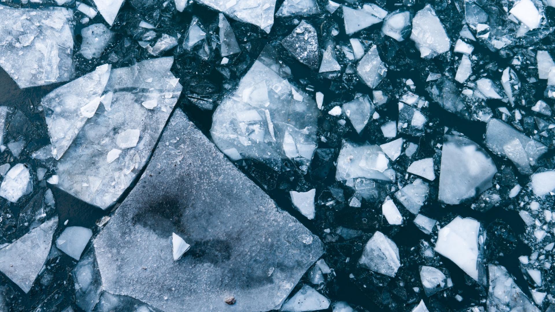 Broken ice in a dark blue background