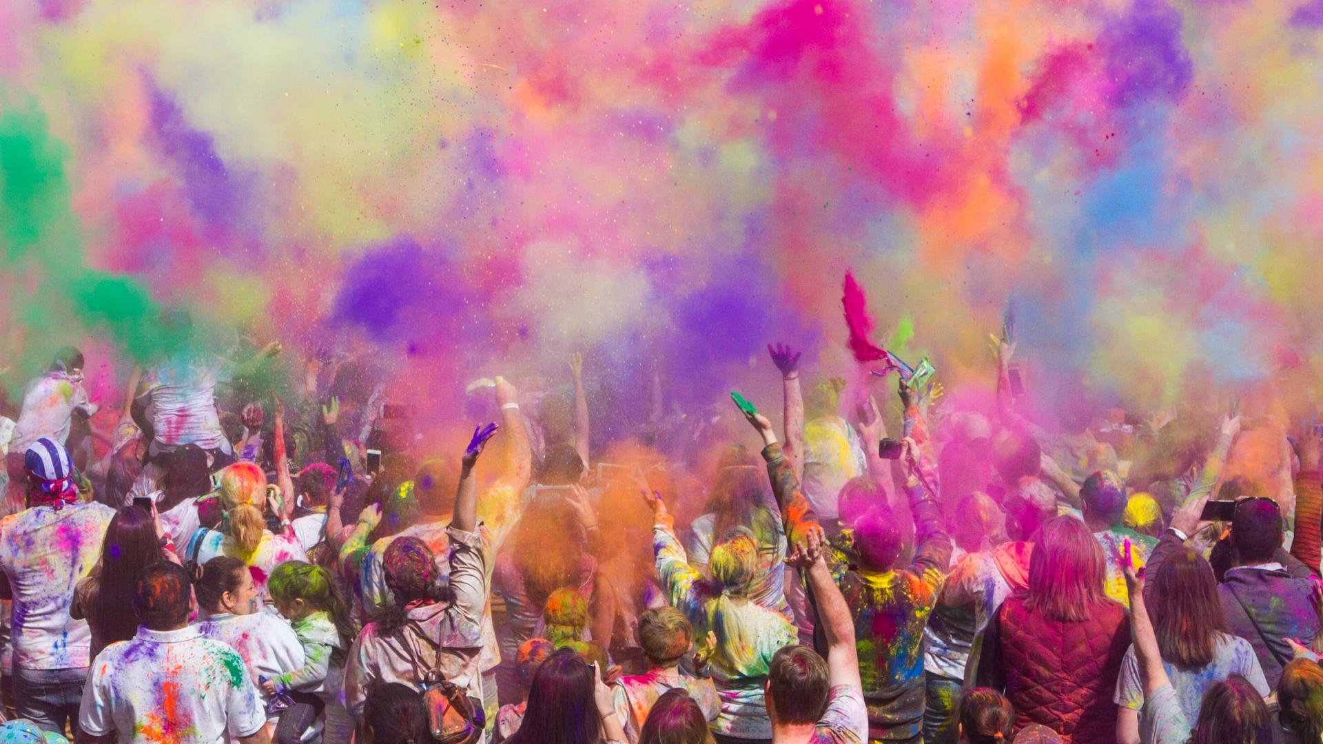 Coloured powders fill the air at the Holi festival