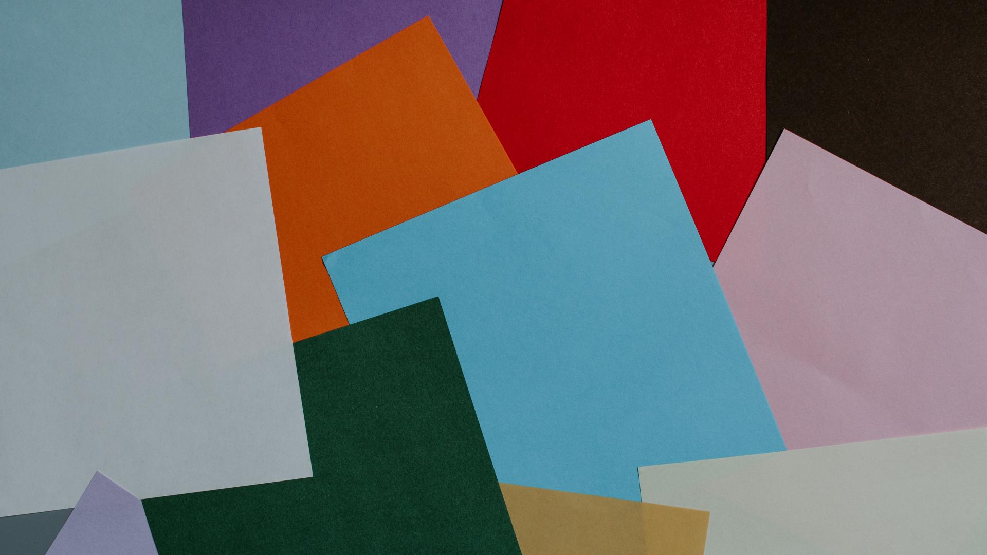 different coloured pages of paper overlapping