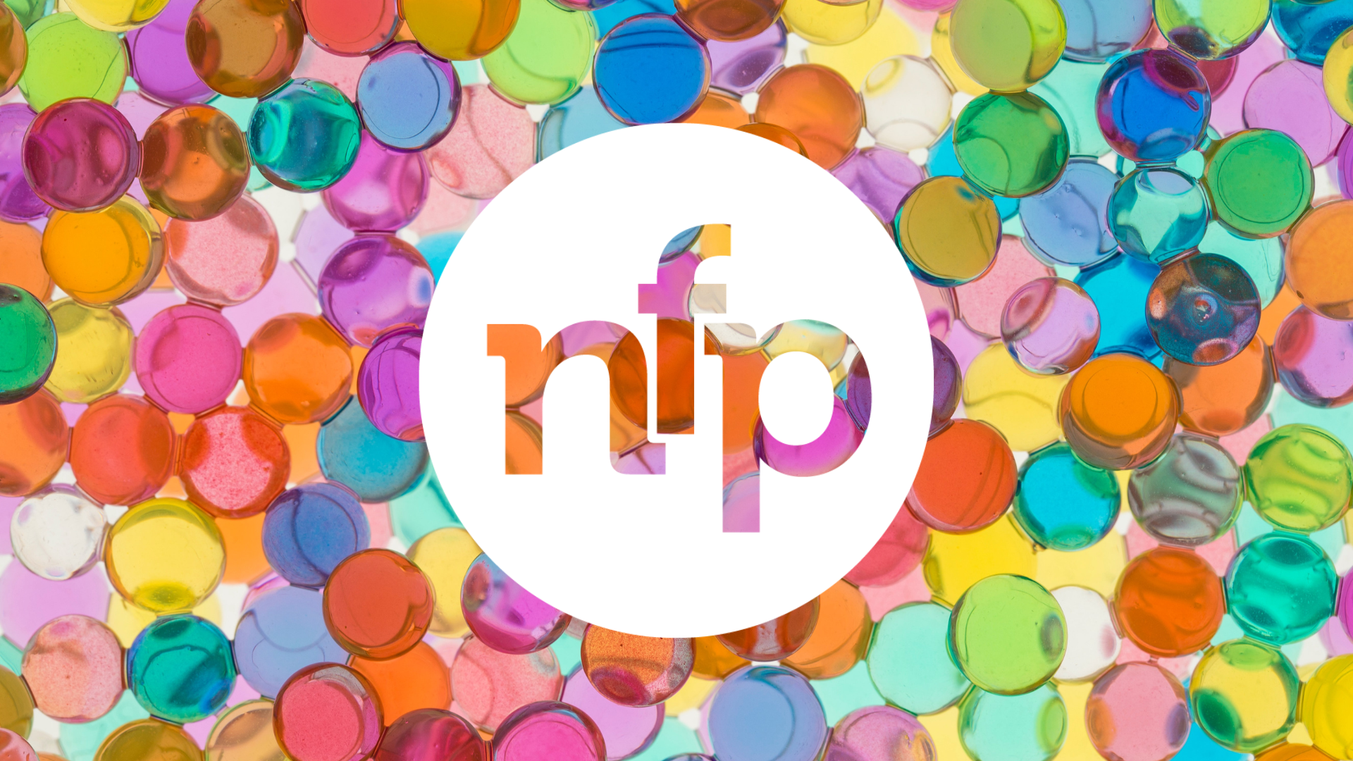 nfpresearch new logo in white set against colourful marbles
