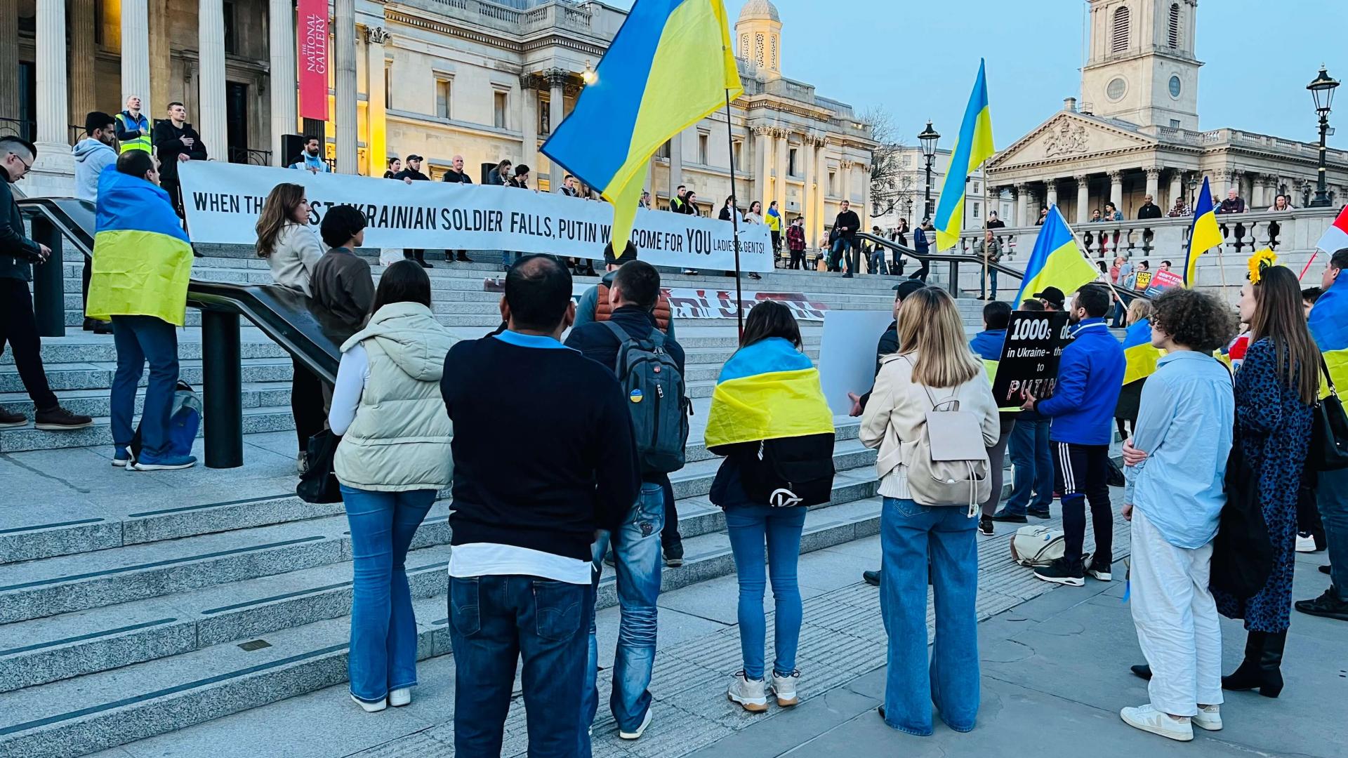 People with Ukrainian flags protesting in London