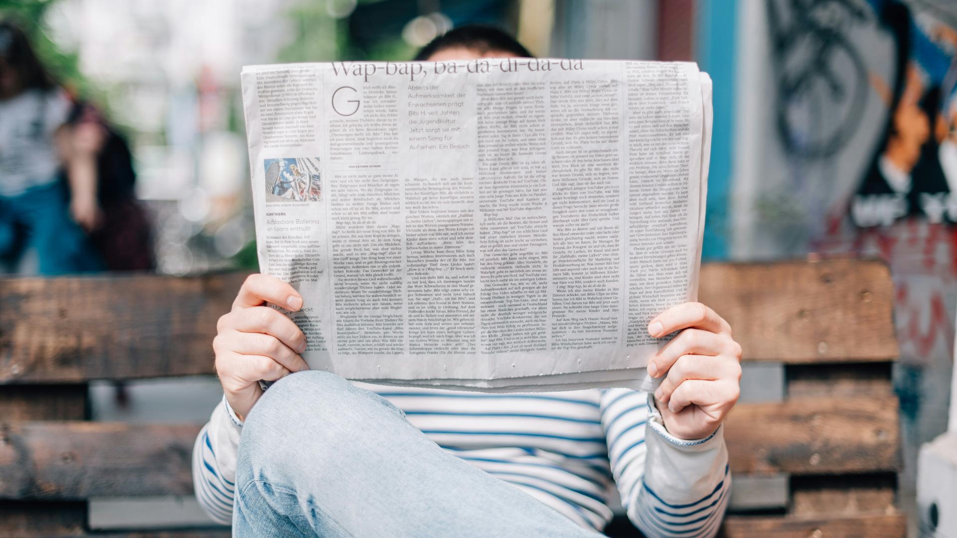 Man with newspaper